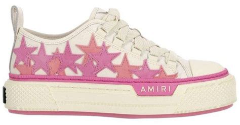 pink amiri shoes with stars.